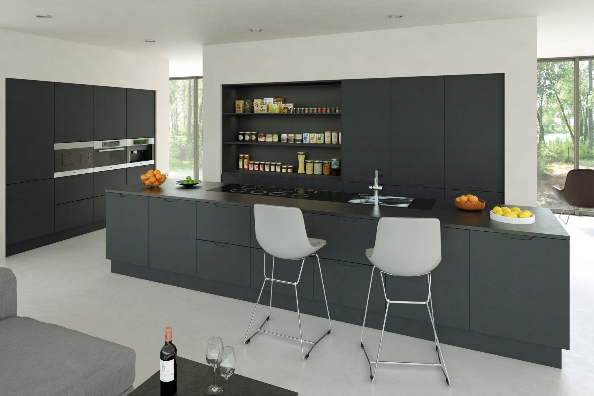 Modern kitchen with dark grey cabinets, white countertops, and white chairs.
