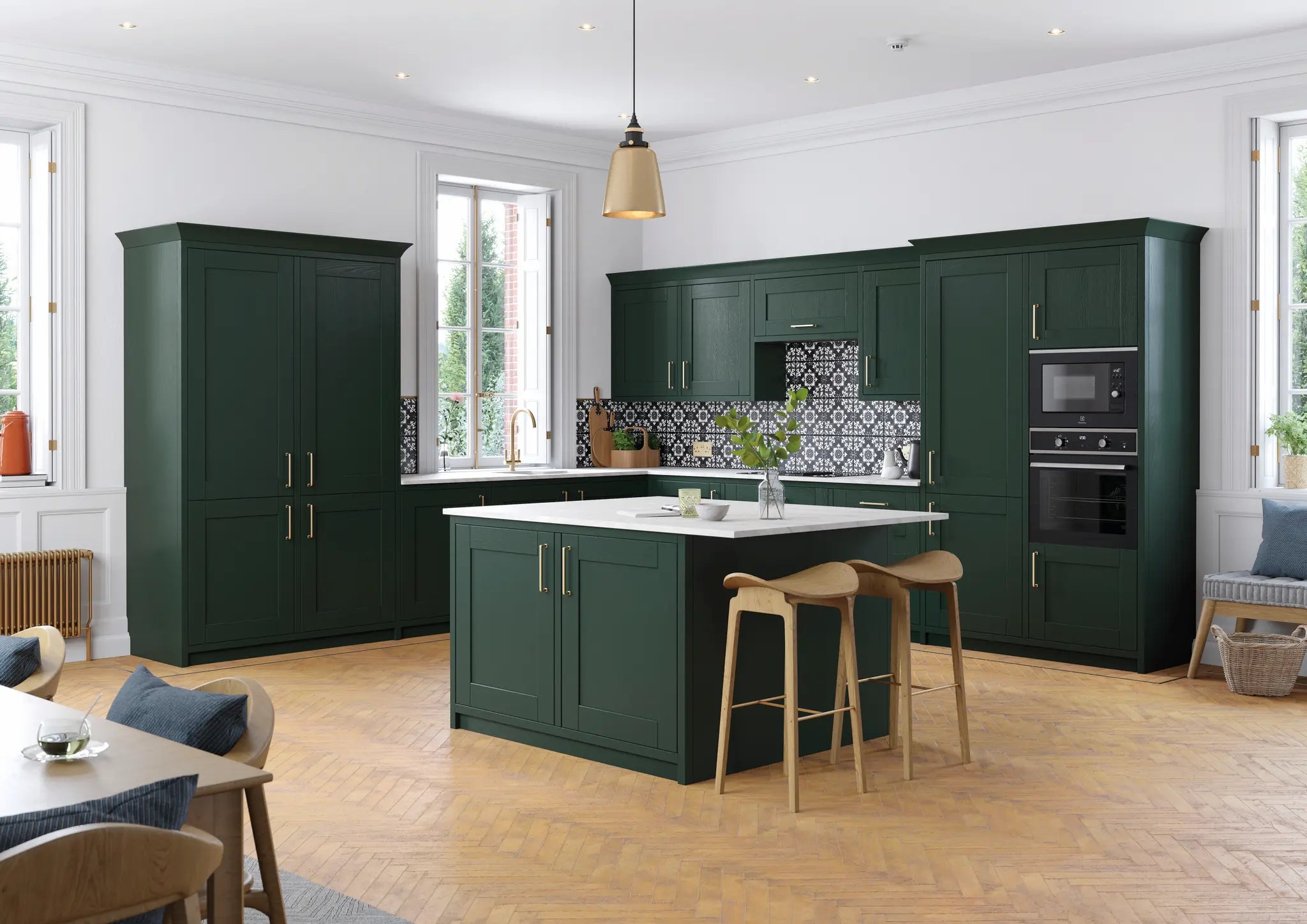Cambridge kitchen with fir green cabinet doors and a central island.