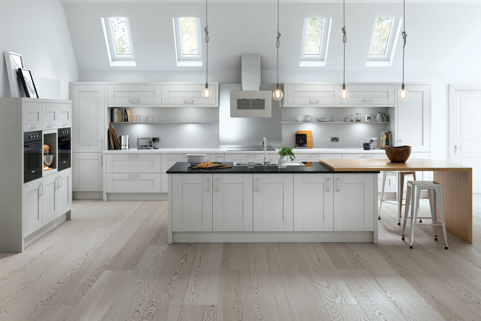 Modern kitchen with light grey cabinets, wooden island, and skylights.