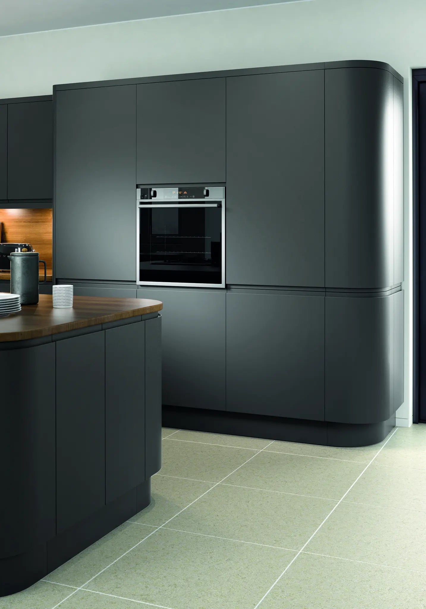 Modern Lucente kitchen with anthracite doors and curved doors featuring an island with a wooden worktop.