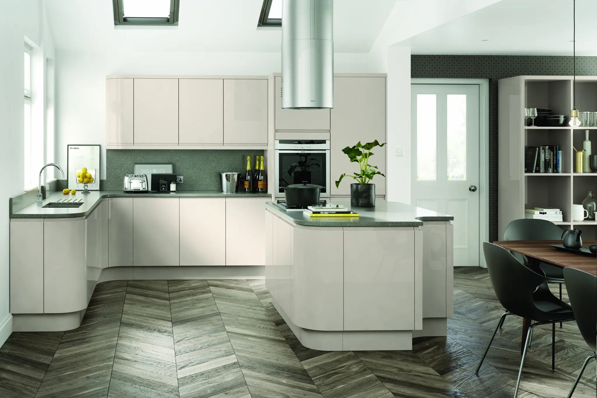 Modern Lucente kitchen with cashmere gloss cabinet doors and accessories, grey countertops, and a dining area.
