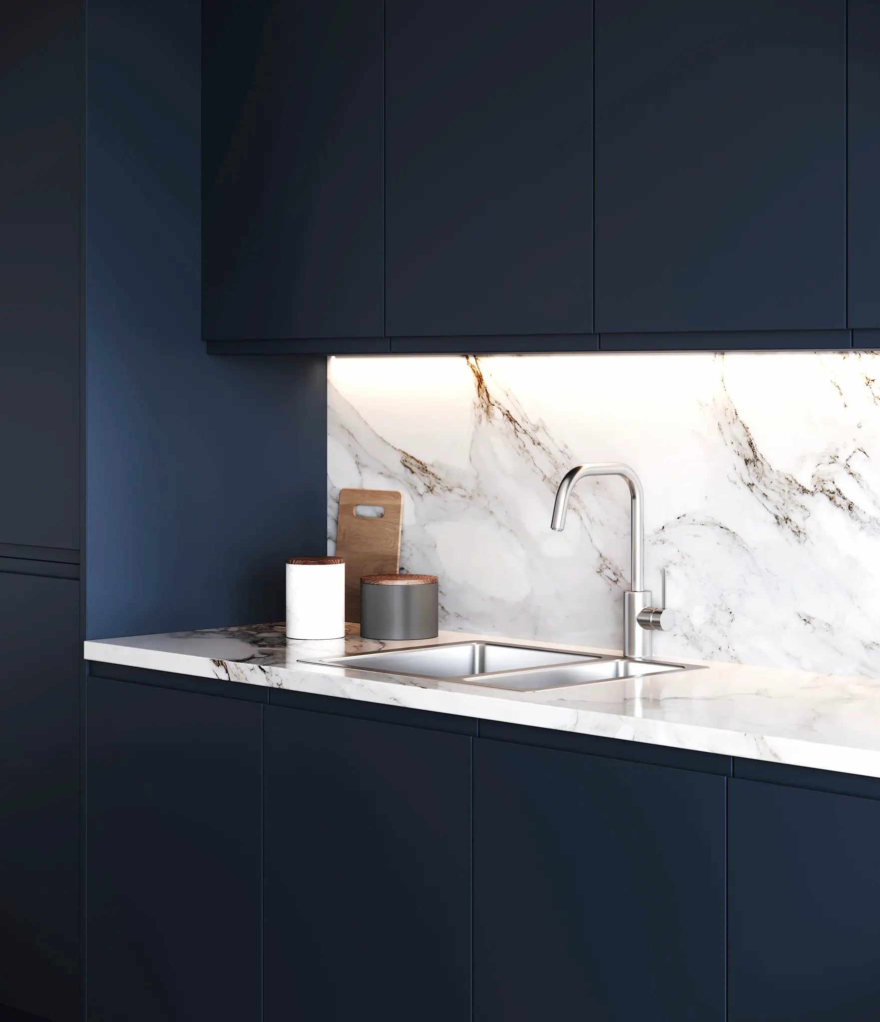 Modern Lucente Indigo kitchen, white marble backsplash, and stainless steel sink. Features a tall end panel.