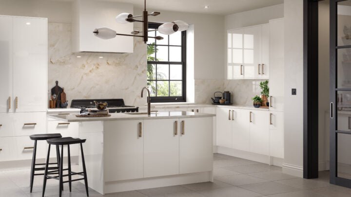 Modern Ora kitchen with white cabinets, island, and black bar stools.