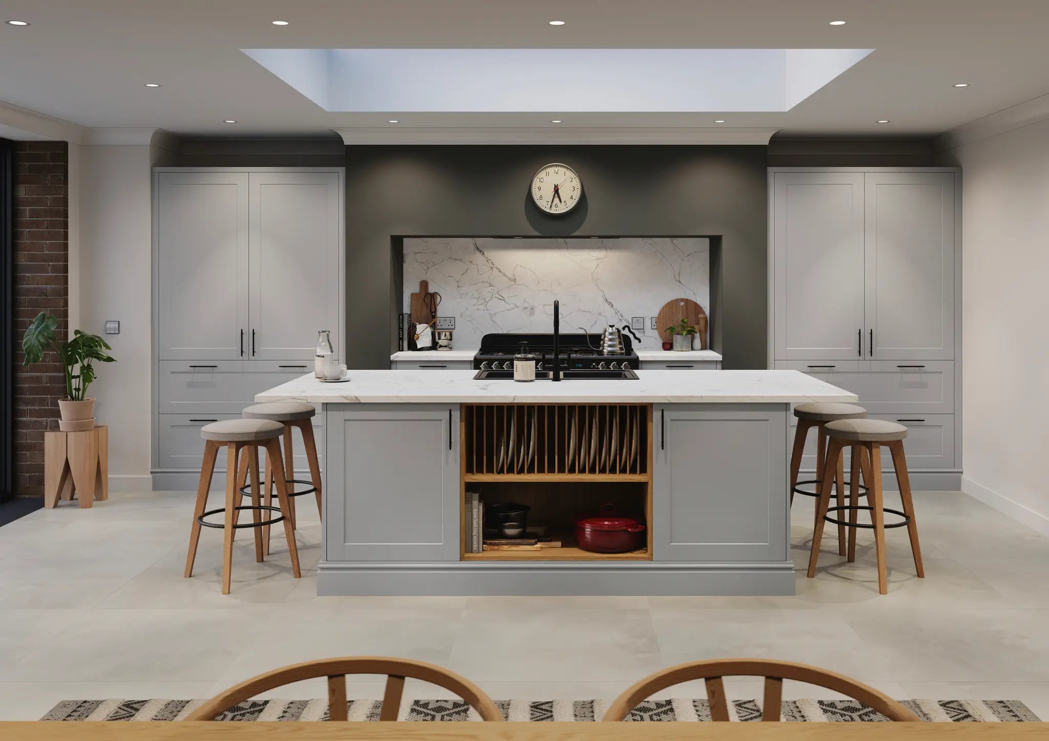 Rydal kitchen with grey island, white countertops, and wooden stools.