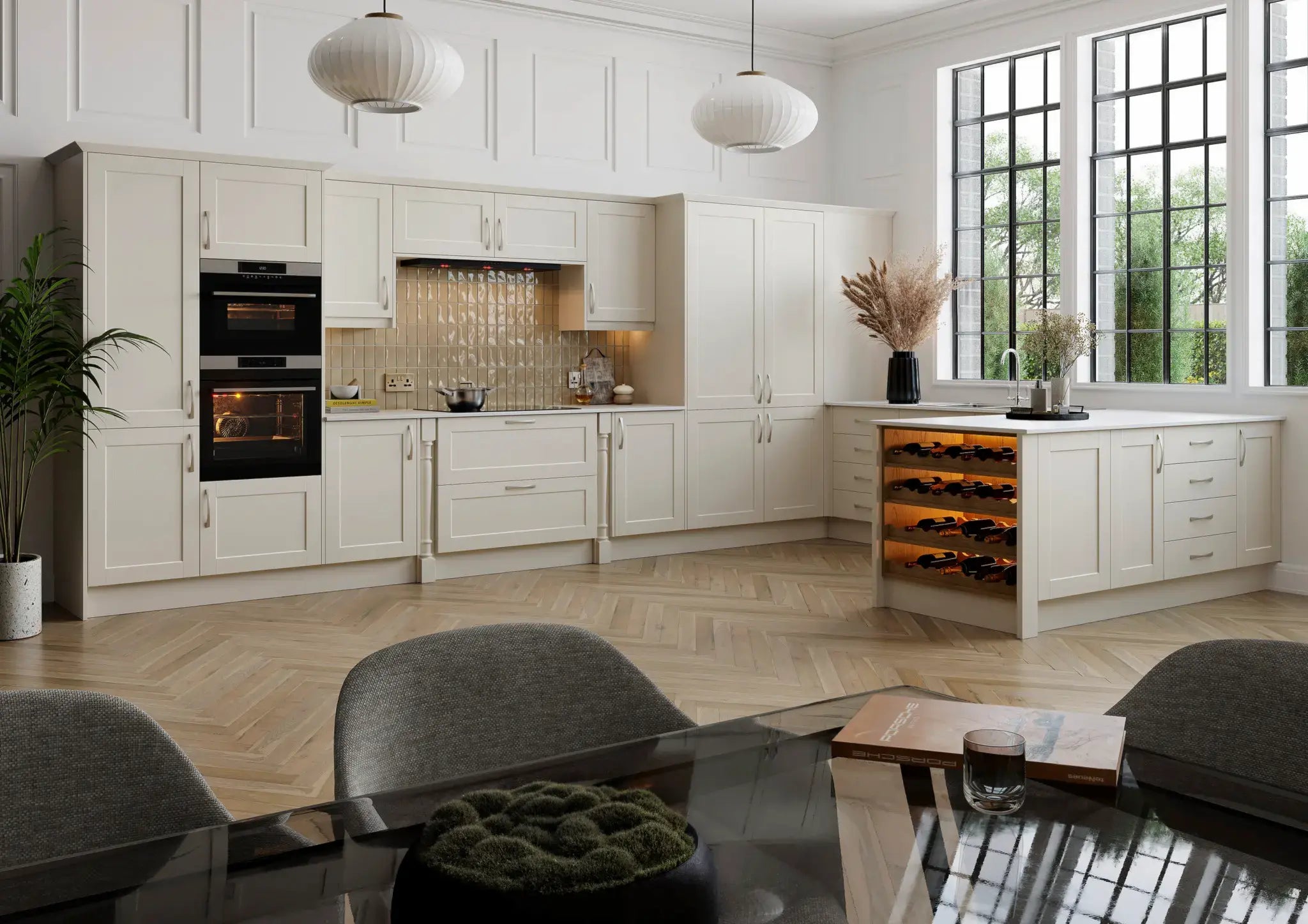 Rydal kitchen with white cabinets, black appliances, and a dining area.
