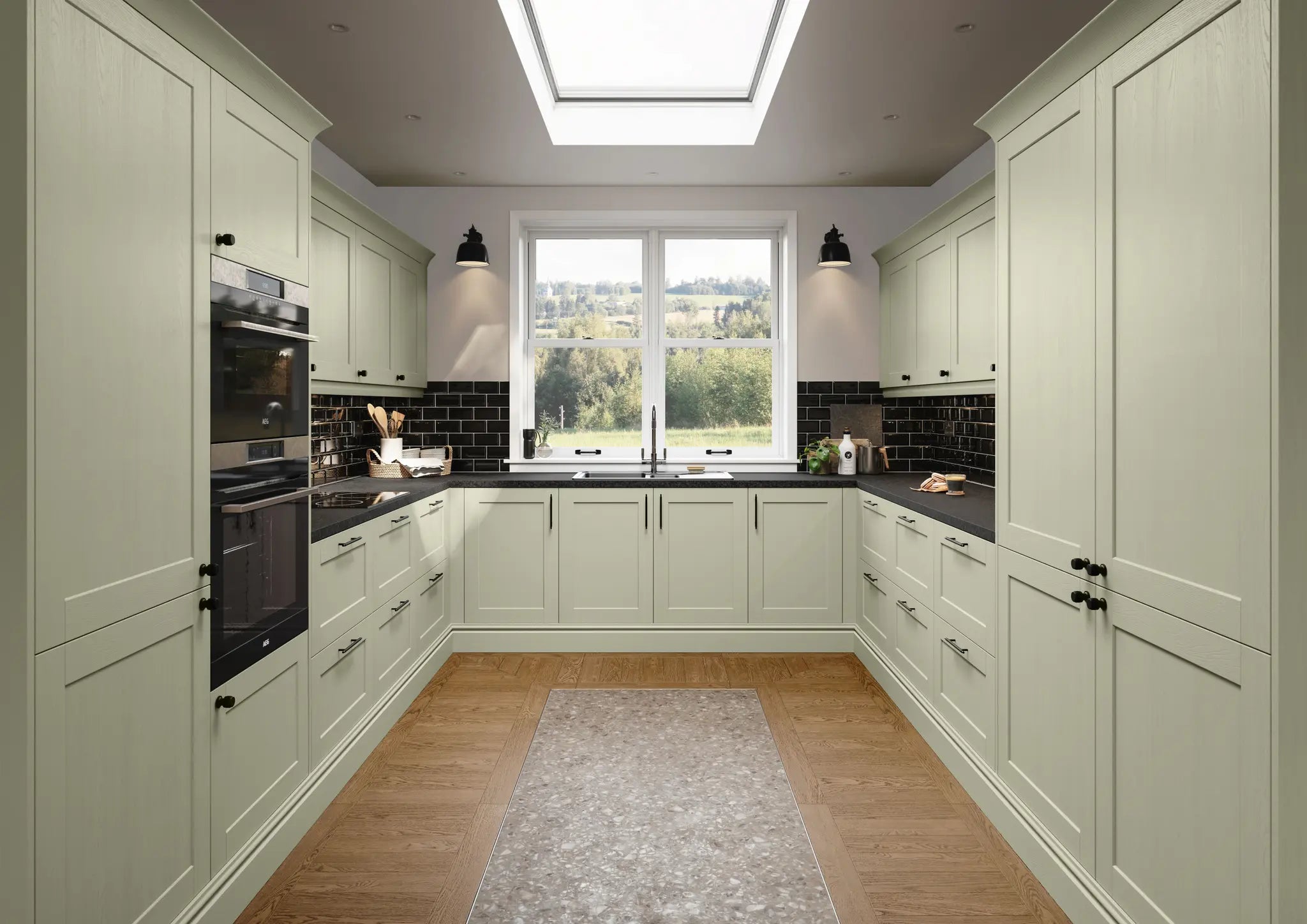 Modern shaker kitchen with sage green cabinet doors, black countertops and tiles.
