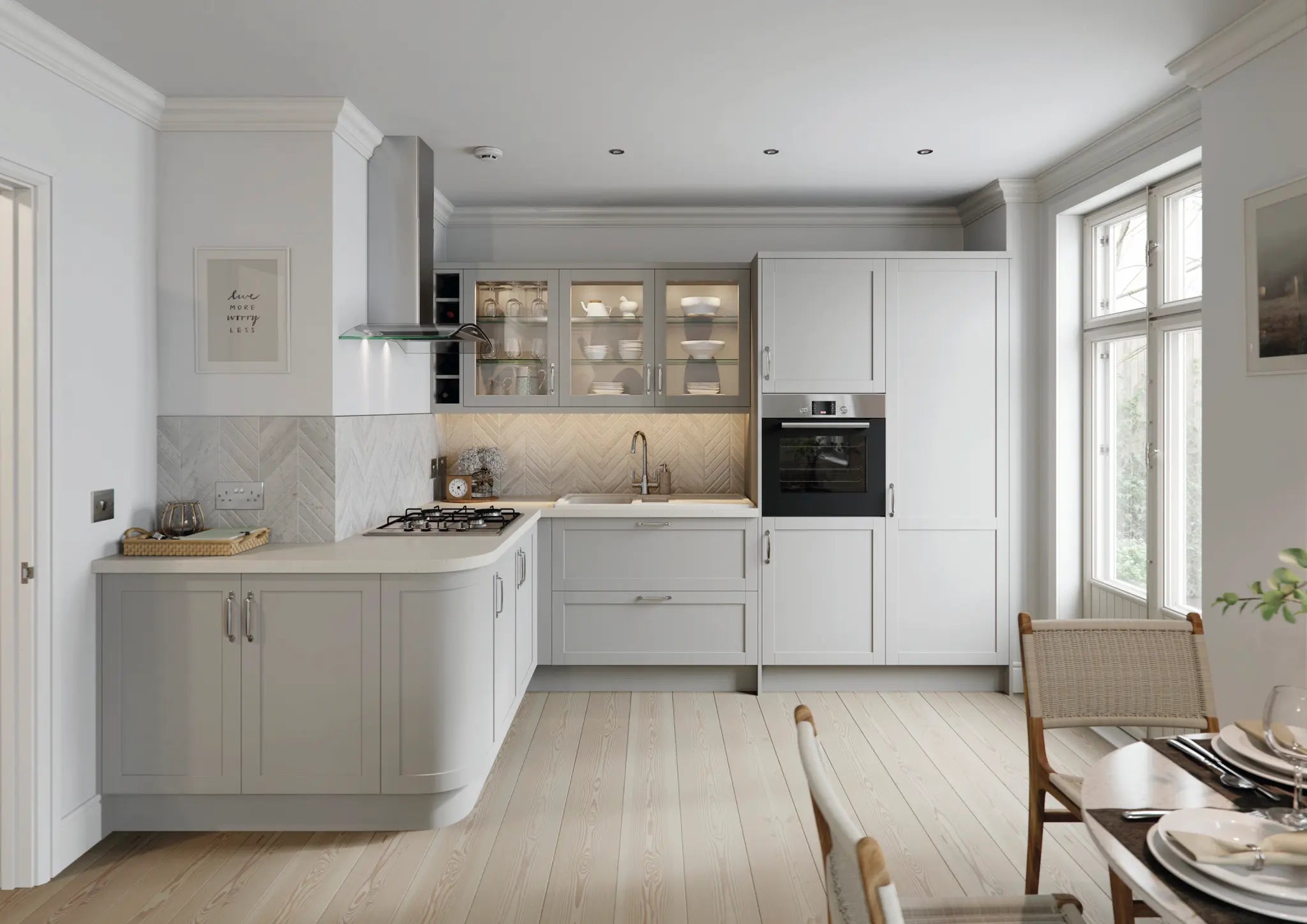 Modern kitchen with Stratto light grey doors and a dining area.