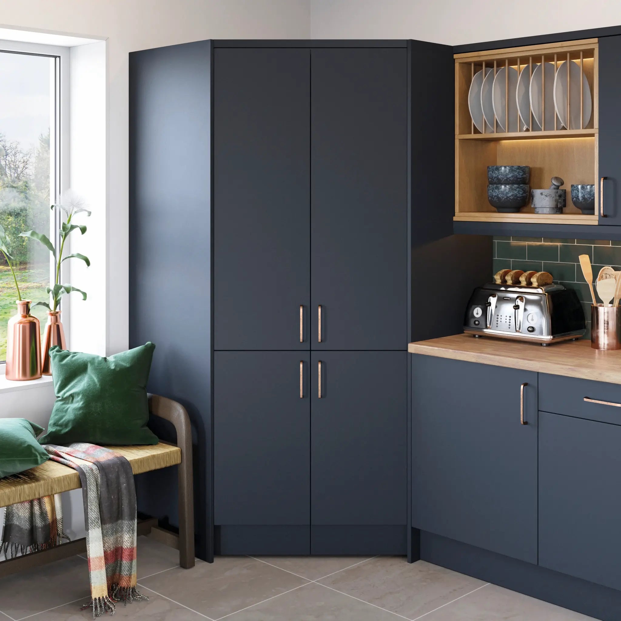 Modern Vivo matt kitchen with indigo cabinets, wooden bench, and toaster.