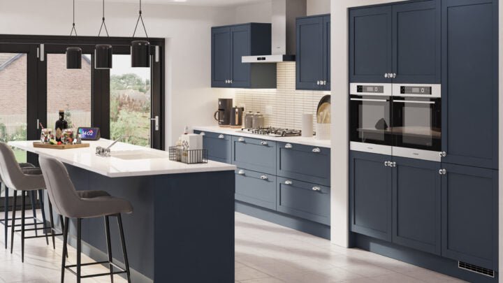 Waterford kitchen with indigo matt cabinet doors, white countertops, and grey chairs.