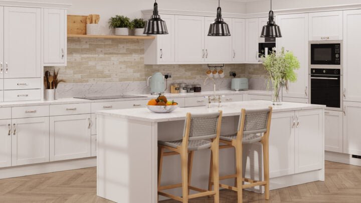 Modern Waterford kitchen with light grey cabinet doors, marble countertops, and wooden flooring.