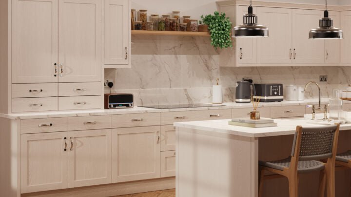 Modern kitchen with white cabinets, marble countertop, and stainless steel appliances.