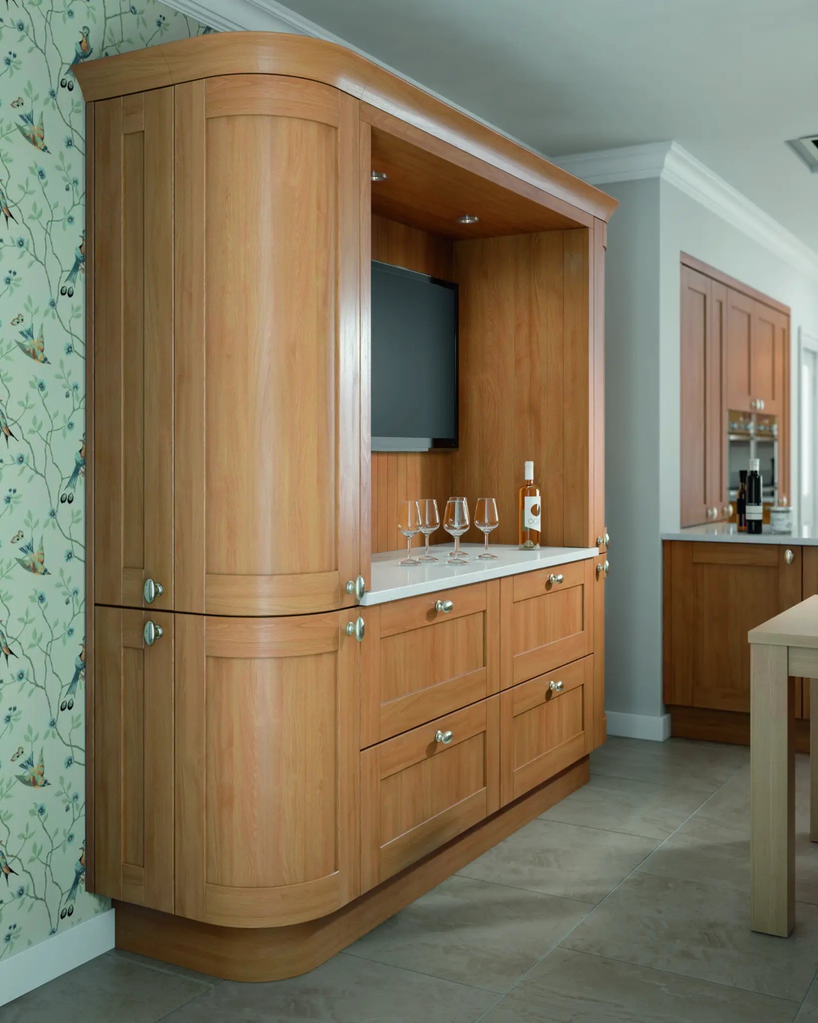 Entertainment centre featuring curved oak doors with curved cornice and plinth. in a room setting.
