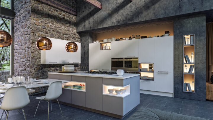 Modern Zurfiz kitchen with white cabinets, stone walls, and pendant lights.