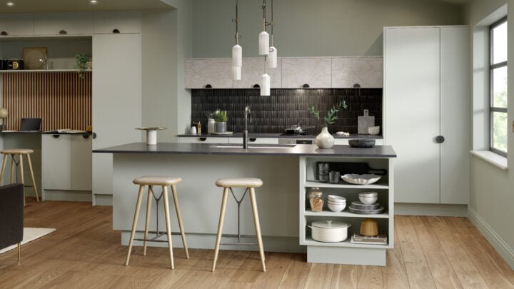 Modern Zurfiz kitchen with grey island, bar stools, and white cabinets.