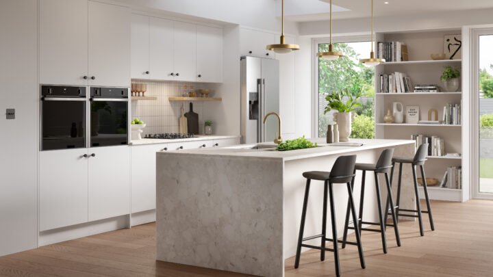 Modern kitchen with white cabinets, island, and bar stools.