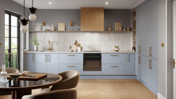 Modern Zurfiz kitchen with light blue cabinets, wooden floor, and grey walls.