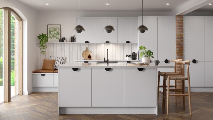Zurfiz kitchen with light grey cabinets, wooden floor, and pendant lights.