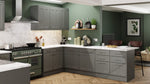 Modern kitchen with dust grey cabinets, white countertops, and green walls.