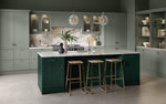 Modern kitchen with fir green island and sage green cabinet doors.