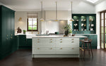 Modern kitchen with green cabinets and a white island