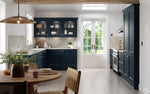 Bella Richmond kitchen in a paint flow matt indigo blue finish. Featuring three glazed doors on the wall units.