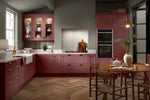 Bella Richmond kitchen in matt rusty red. Featuring glazed wall unit doors.