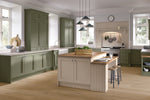 Modern kitchen with green cabinets and a central island.