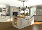 Modern kitchen with white cabinets, wooden island, and decorative elements.