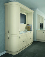 Shaker style kitchen featuring curved doors, cornice and plinth. Painted in a Mussel finish.