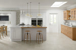 Light Grey and Oak shaker kitchen with breakfast bar featring light grey tongue and groove panelling.