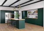 Modern Cartmel kitchen with fir green cabinet doors, wooden island, and stainless steel appliances.