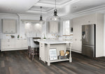 Modern kitchen with white cabinets, island, and stainless steel appliances.