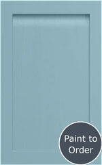 A denim blue shaker style door with a solid ash frame and a veneered centre panel, hand painted with visible timber grain.