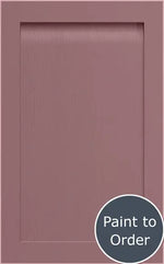 A painted Dusky Pink Grantham door. At the bottom right there's a red circular sign with Paint to Order in white letters.
