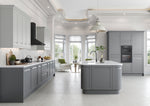 Modern kitchen with grey cabinets and white countertops