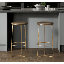 Two bar stools with gold metal legs and wooden seats in a kitchen setting.
