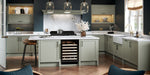 Modern kitchen with white countertops, grey cabinets, and wine cooler.