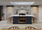 Rydal Indigo kitchen with a central island, bar stools, and a prominent plate rack.