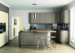 Modern Lucente kitchen with grey cabinets, island, and bar stools.