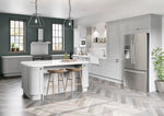 Modern Newmarket kitchen with grey cabinet doors. Features an island with curved doors and t&g panelling. With stainless steel appliances.