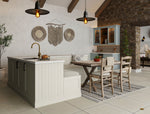 Modern kitchen with island, dining table, and chairs.