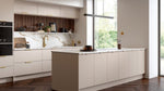 Ora kitchen with white cabinets, marble countertop, and large window.