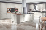 Oxford kitchen with light grey cabinets, island, and decorative elements.