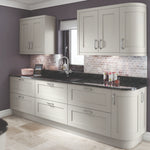 Oxford shaker kitchen with light grey cabinets, doors and plinth. With black countertop, and tiled backsplash.