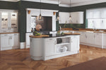 Modern Oxford kitchen with Mantel Kit, white island and green walls.
