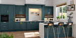 Modern kitchen with teal cabinets, white countertops, and bar stools.