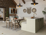 Modern kitchen with dining area featuring a kitchen island, table, and chairs.