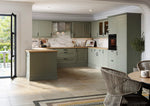 Modern shaker kitchen with green cabinets and tongue and groove panelling.