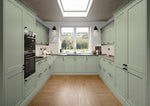 Modern kitchen with french grey cabinets, wooden floor, and large window.
