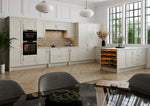 Rydal kitchen with white cabinets, black appliances, and a dining area.